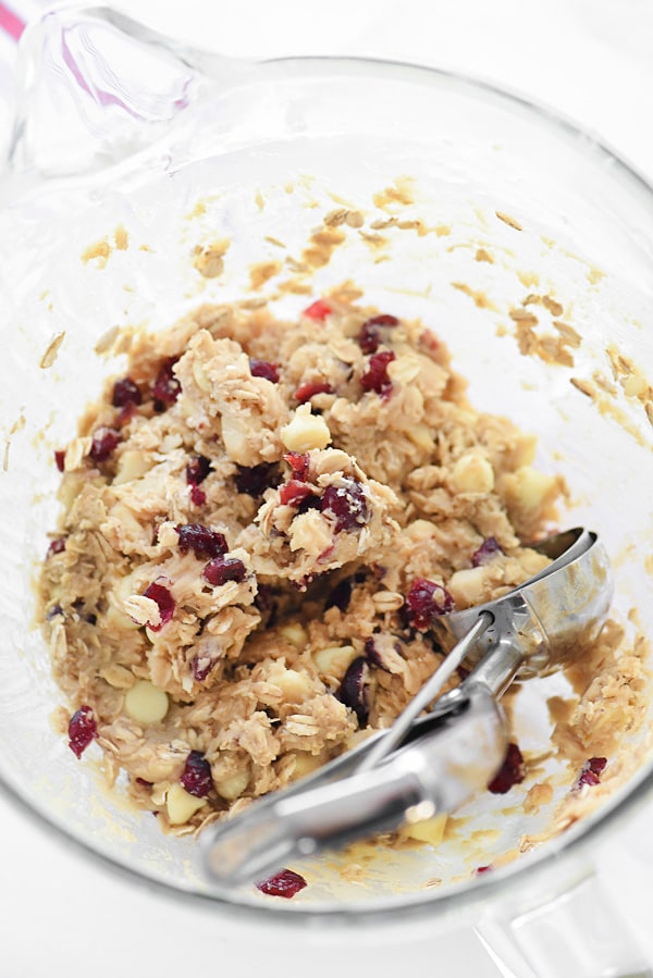 oatmeal cranberry white chocolate chip cookie dough in glass bowl
