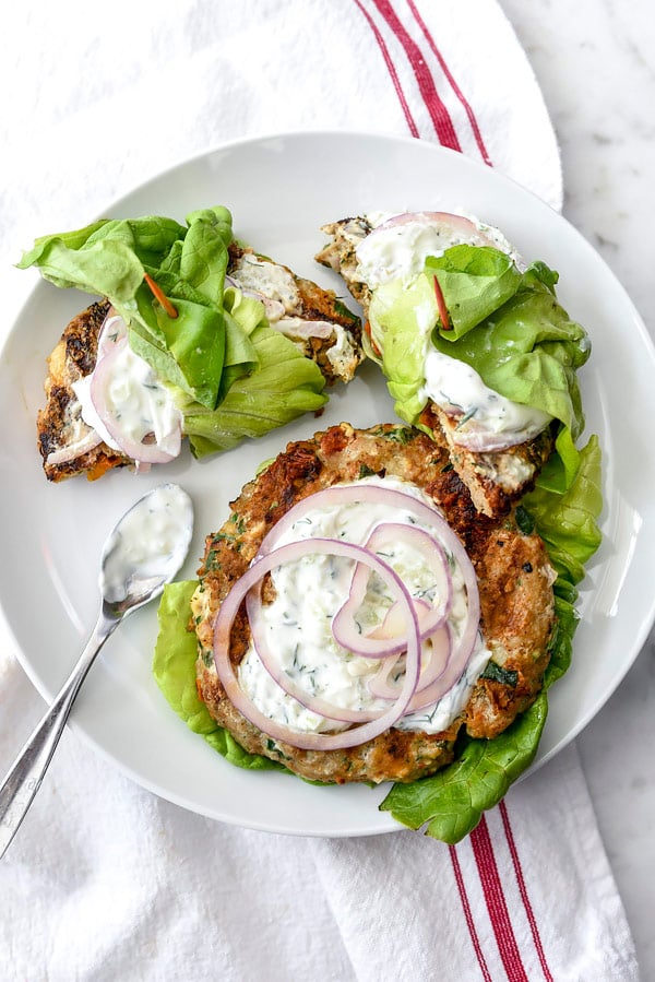Greek Turkey Burgers wrapped in lettuce with Tzatziki Sauce are a low-carb and gluten-free option for burger lovers | foodiecrush.com