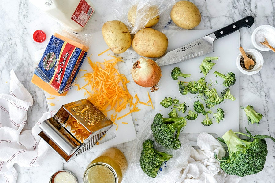 Delicious Cheddar Broccoli Soup Recipe 2 broccoli potato cheese soup ingredients on countertop