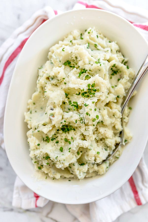 creamed Cauliflower with Parmesan in white serving dish