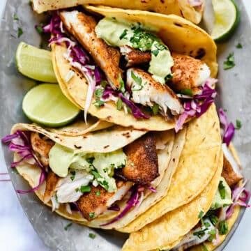 Blackened Fish Tacos with Creamy Avocado Sauce | foodiecrush.com