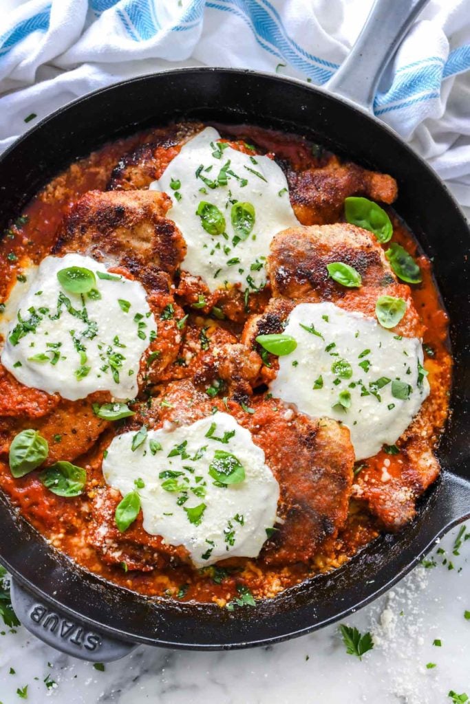 homemade chicken parmesan in large cast iron skillet