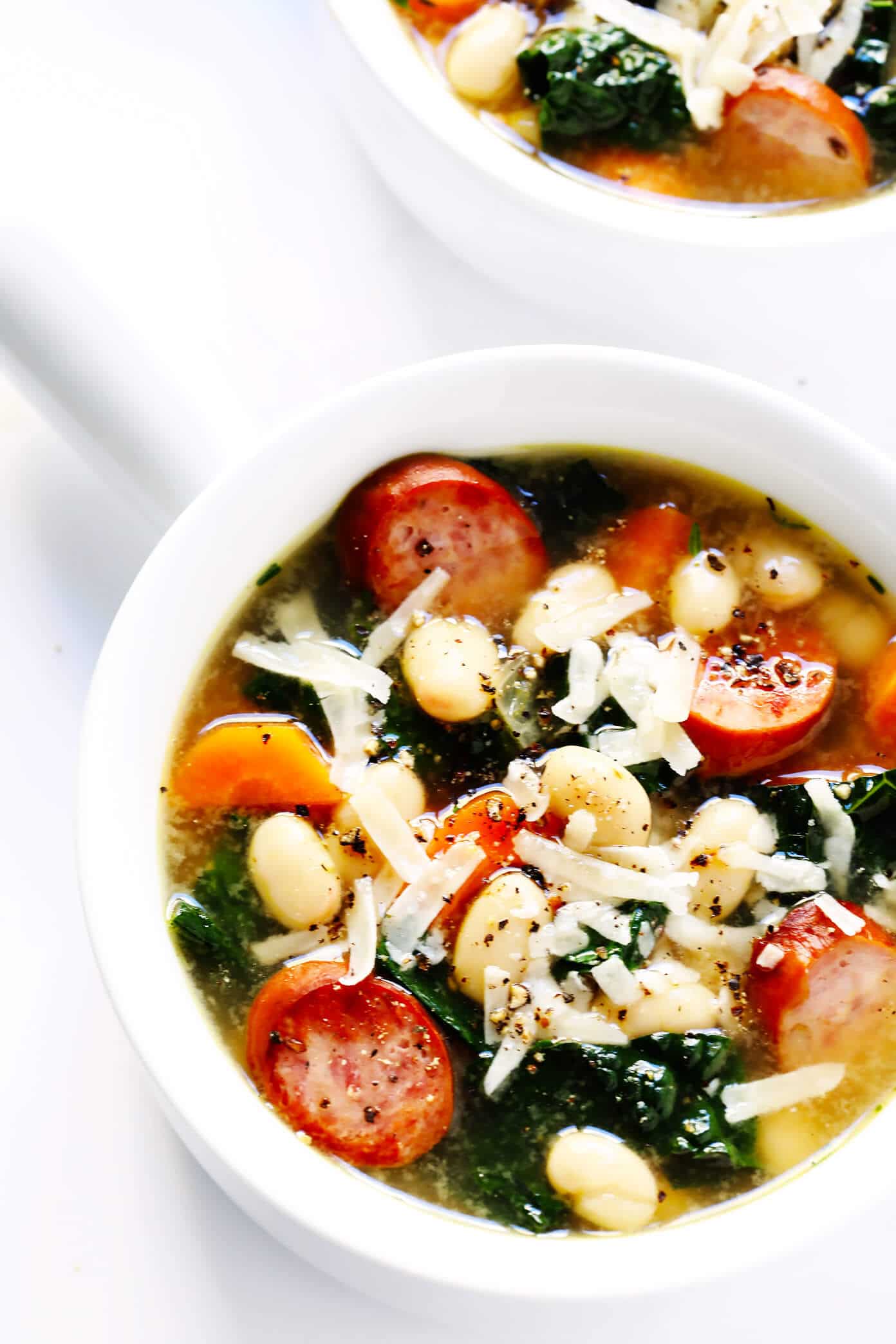 Tuscan White Bean, Sausage and Kale Soup from gimmesomeoven.com on foodiecrush.com