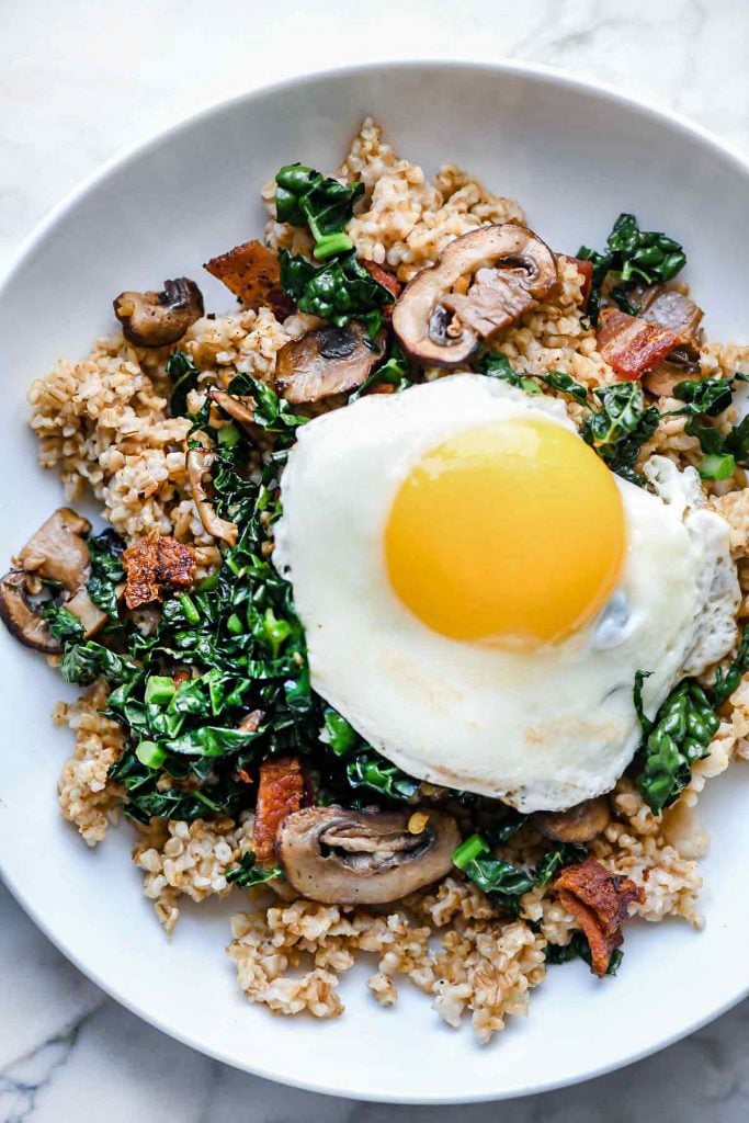 instant pot steel cut oats topped with fried egg and greens