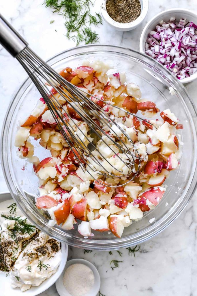Mashing Creamy Dill Potato Salad | foodiecrush.com #potatosalad #salad #recipes #side #dill #potato