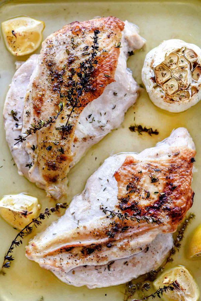 two roast turkey breasts with garlic and lemon