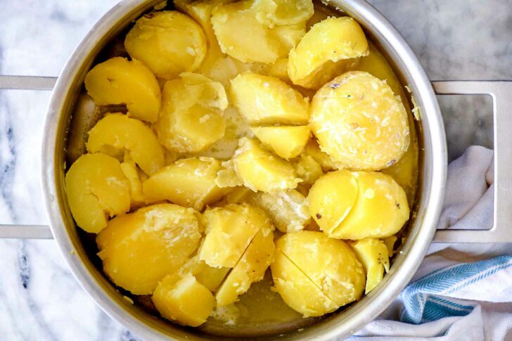 Potatoes with butter and half and half in a pot | foodiecrush.com