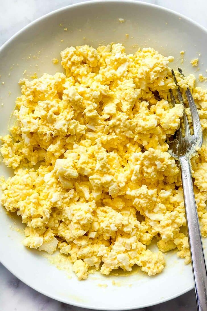 Classic Egg Salad recipe in bowl with fork foodiecrush.com
