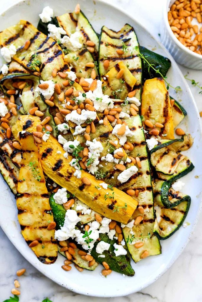 Grilled Zucchini with Goat Cheese and Pine Nuts | foodiecrush.com #zucchini #pinenuts #sidedish #healthy #grilled