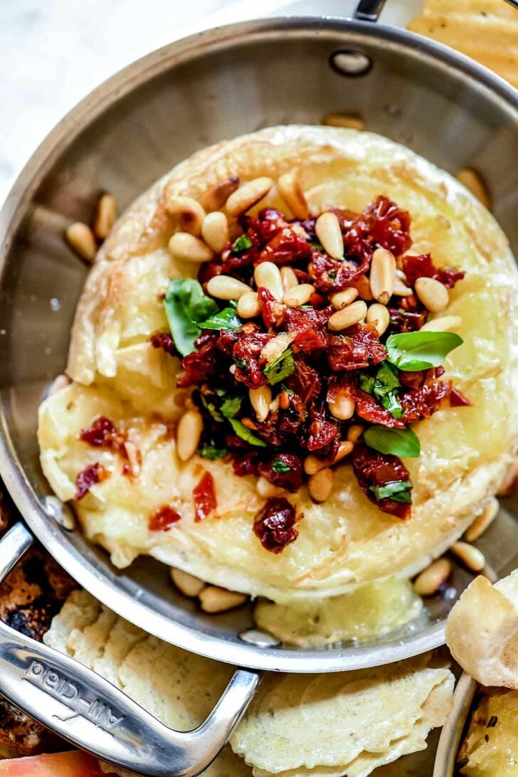 Sun Dried Tomato Baked Brie with Pinenuts | foodiecrush.com #appetizer #baked #brie #holiday #recipes #apptetizer