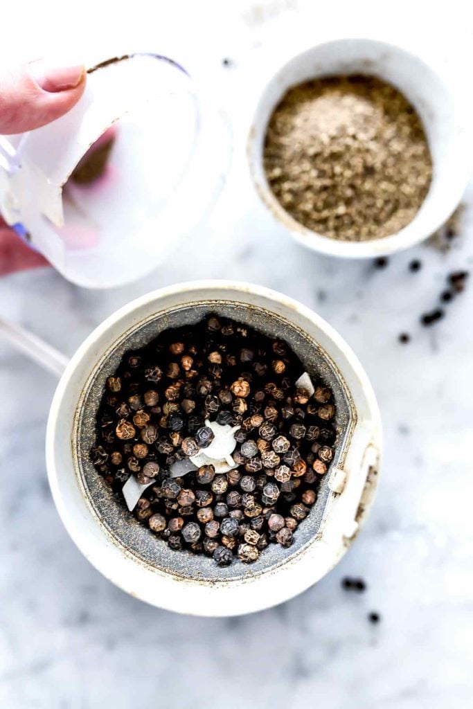 Black peppercorns in coffee grinder | foodiecrush.com