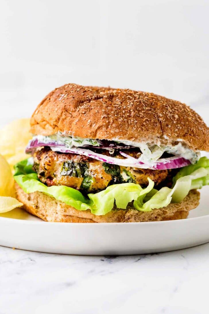 Greek Turkey Burger on plate with chips