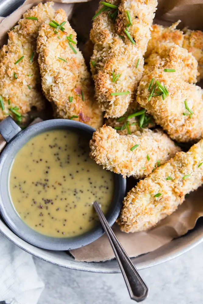 Healthy Baked Chicken Tenders with Honey Mustard Sauce from themodernproper.com on foodiecrush.com