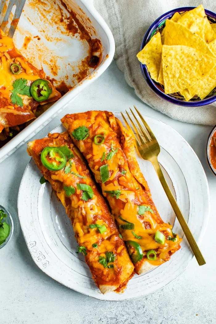 Healthy Chicken Enchiladas from eatingbirdfood.com on foodiecrush.com