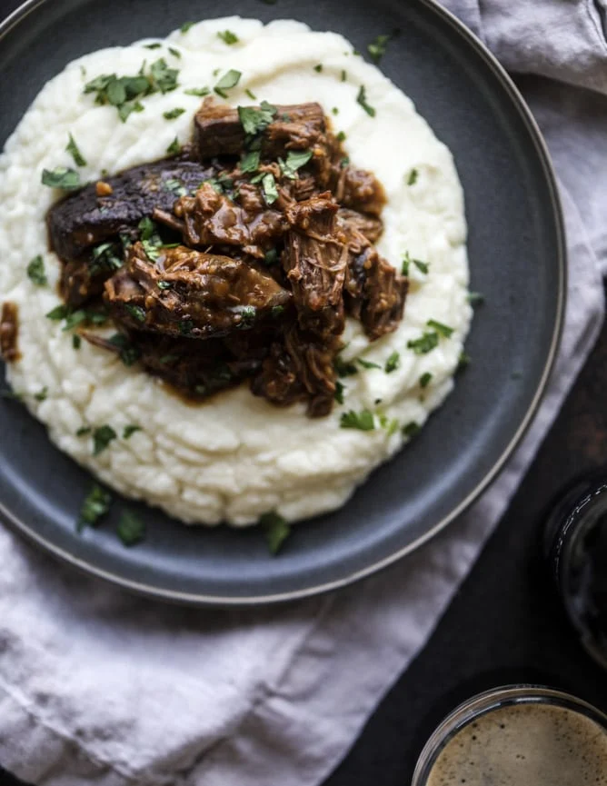 Slow Cooker Guinness Short Ribs with Cheesy Cauliflower Mash from howsweeteats.com on foodiecrush.com
