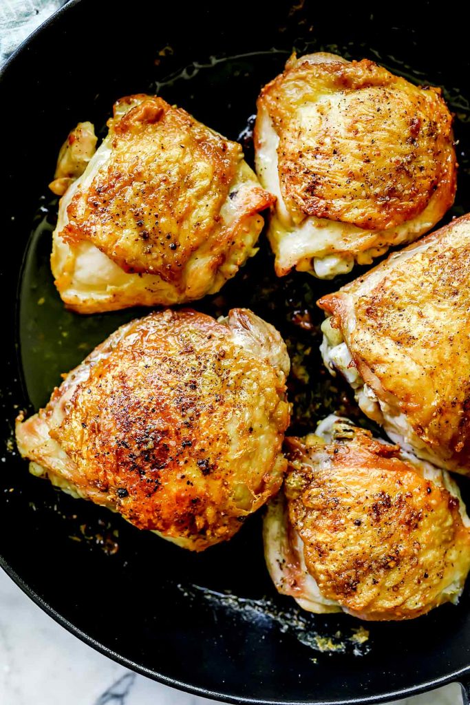How to Cook THE BEST Chicken Thighs on stove then in oven foodiecrush.com