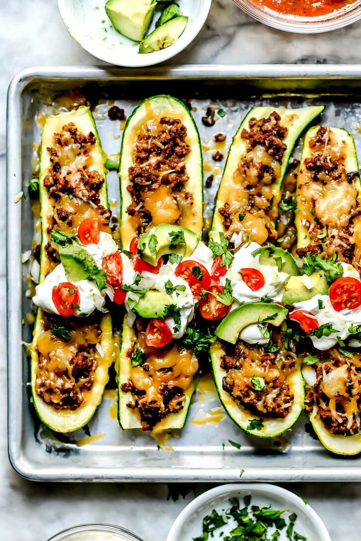 Taco Stuffed Zucchini Boats with toppings foodiecrush.com