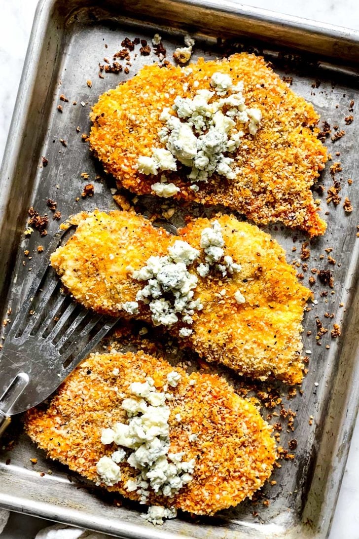 Crispy Baked Buffalo Chicken Breasts 7 Baked Buffalo Chicken Breasts with Blue Cheese on platter foodiecrush.com