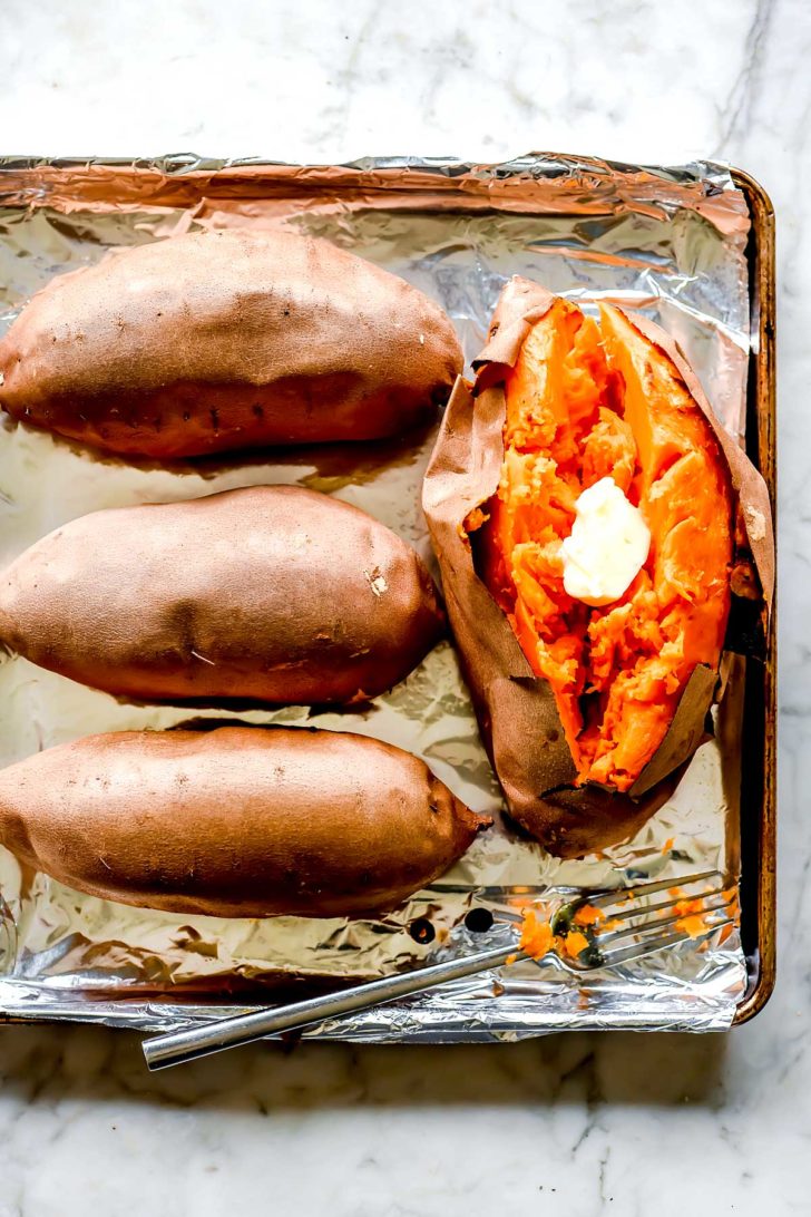 The BEST Roasted Sweet Potatoes on a baking sheet foodiecrush.com