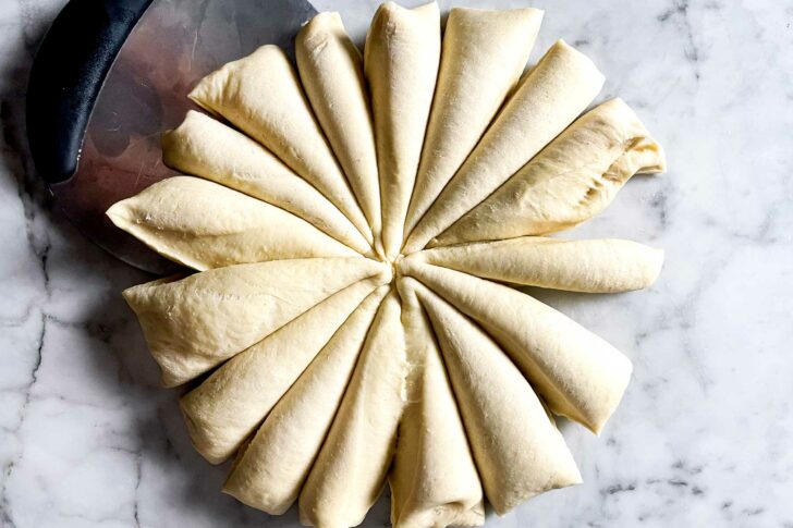 Cutting dough for rolls foodiecrush.com