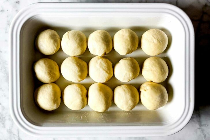 The BEST Easy Dinner Rolls rising in pan foodiecrush.com