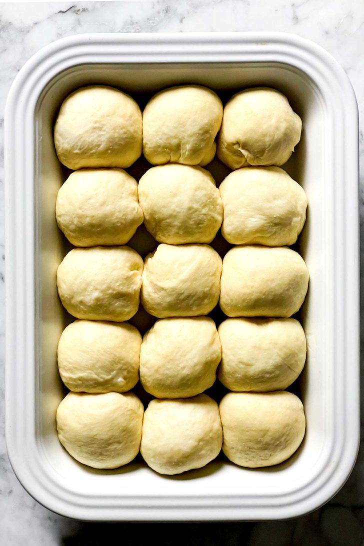 The BEST Easy Dinner Rolls rising in pan foodiecrush.com