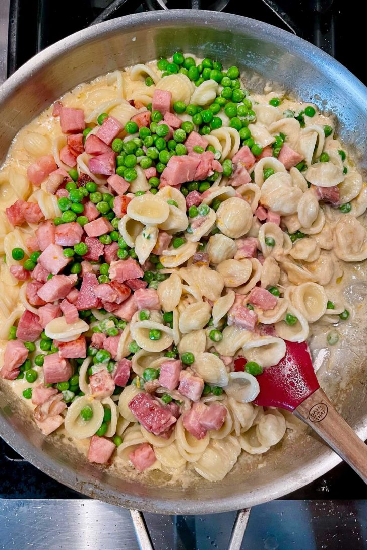 Lemon Pasta with Ham and Peas in skillet on stove foodiecrush.com