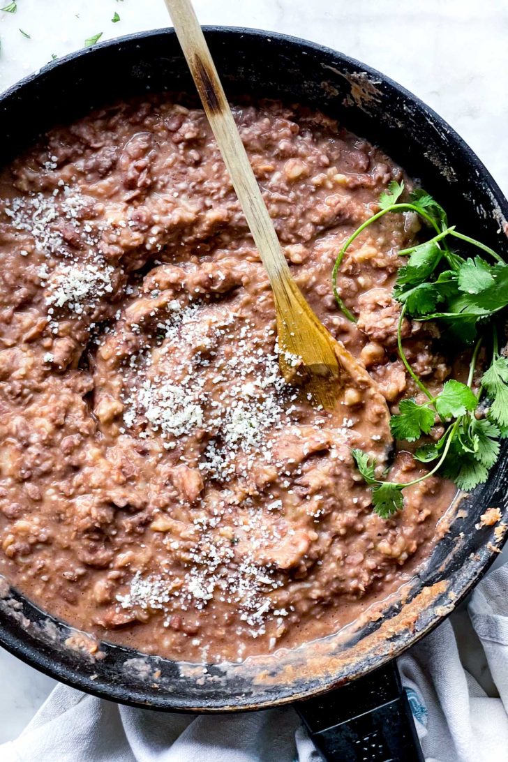How to Make THE BEST Refried Beans foodiecrush.com