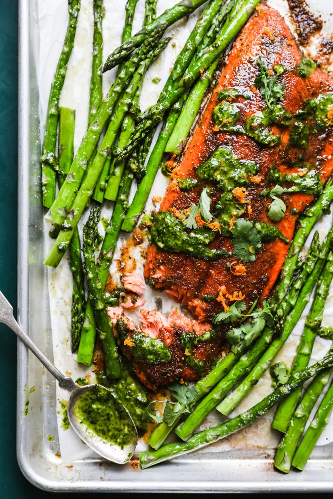 Blackened Salmon Sheet Pan with Asparagus and Ginger Cilantro Sauce from themodernproper.com on foodiecrush.com