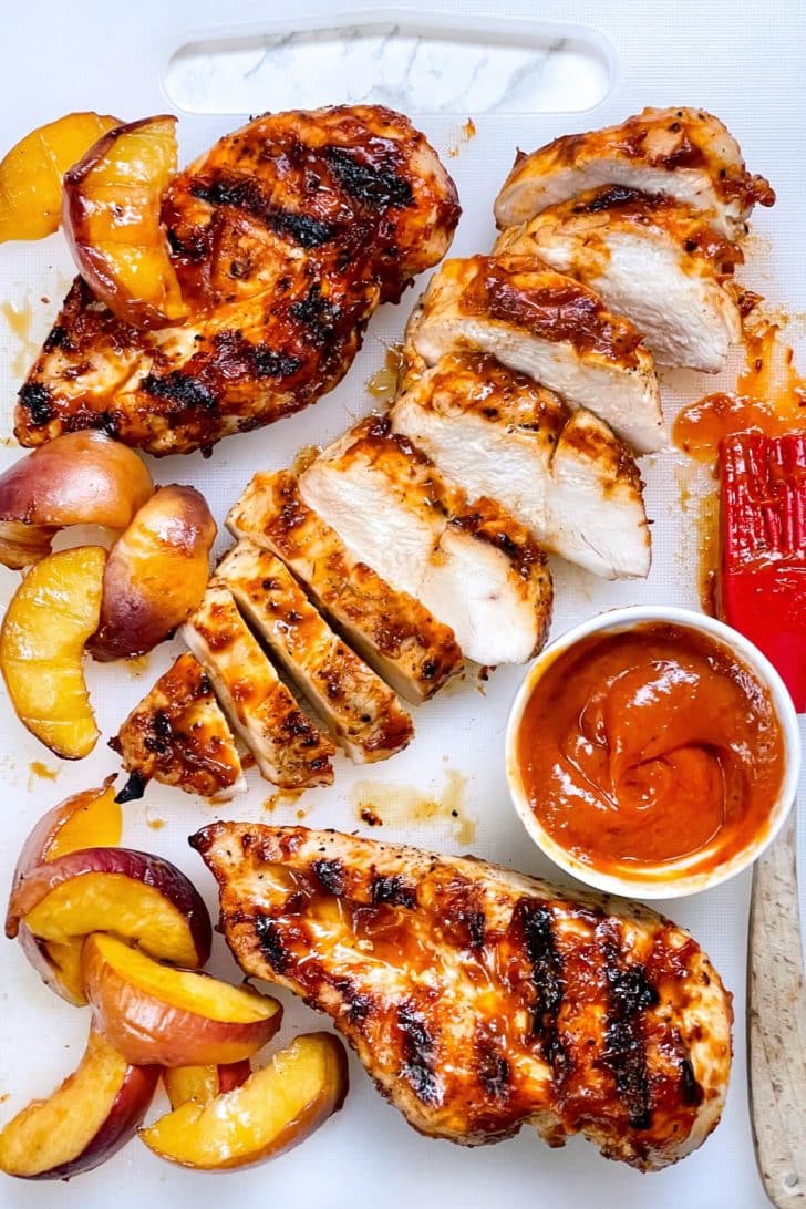 Chipotle Peach BBQ Chicken sliced on cutting board foodiecrush.com
