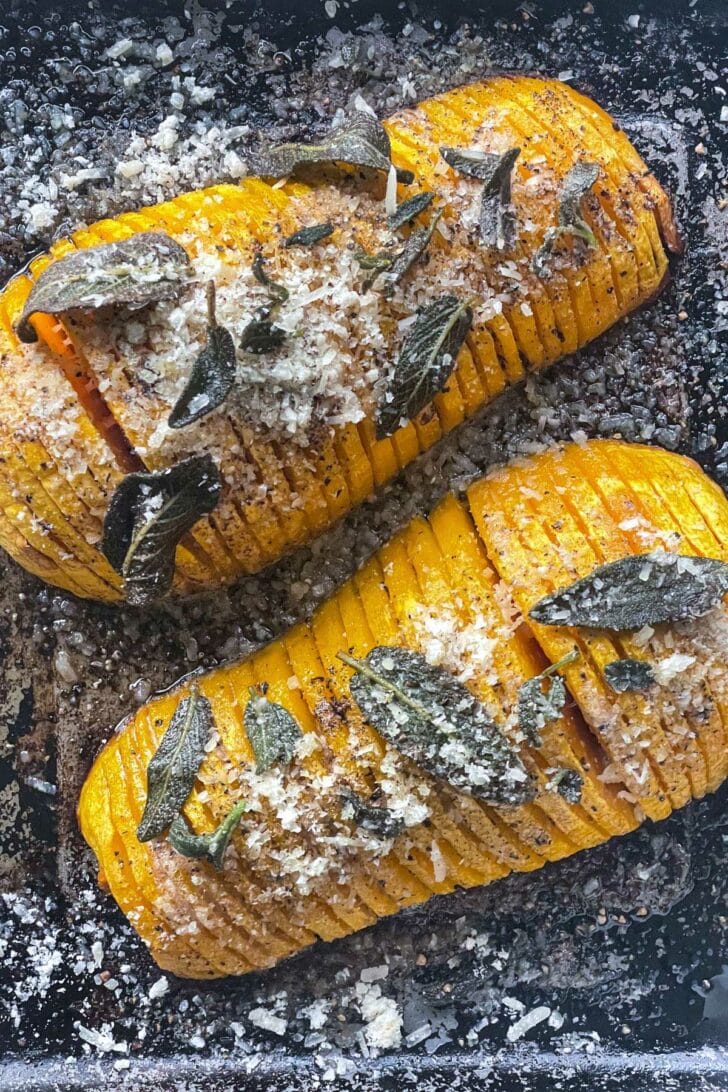 Roasted Butternut Squash with Sage and Parmesan Cheese on baking sheet foodiecrush.com