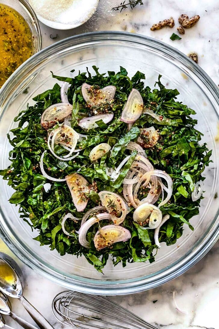 kale and onions mellowing in dressing foodiecrush.com