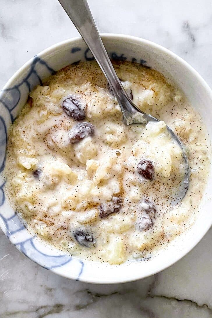 RIce pudding with spoon in bowl foodiecrush.com