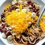 Cincinnati Chili with spaghetti in bowl with fixings foodiecrush.com
