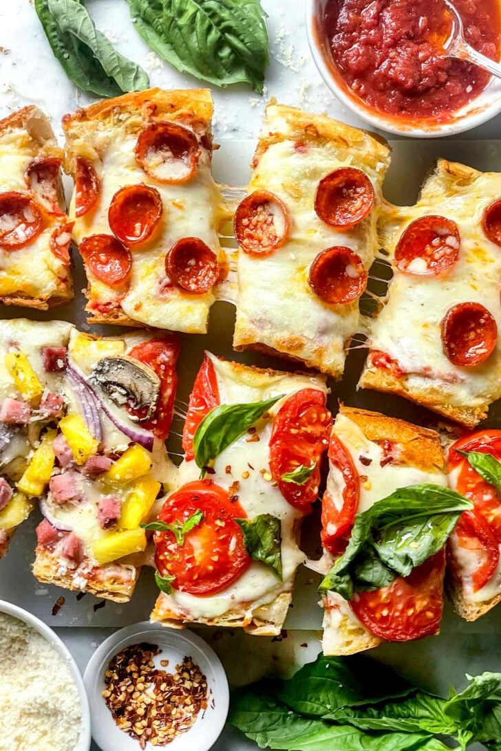 How to make French Bread Pizza French Bread Pizza cut in slices close up everydaydeliciouskitchen.com