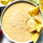 Queso Dip with chip foodiecrush.com