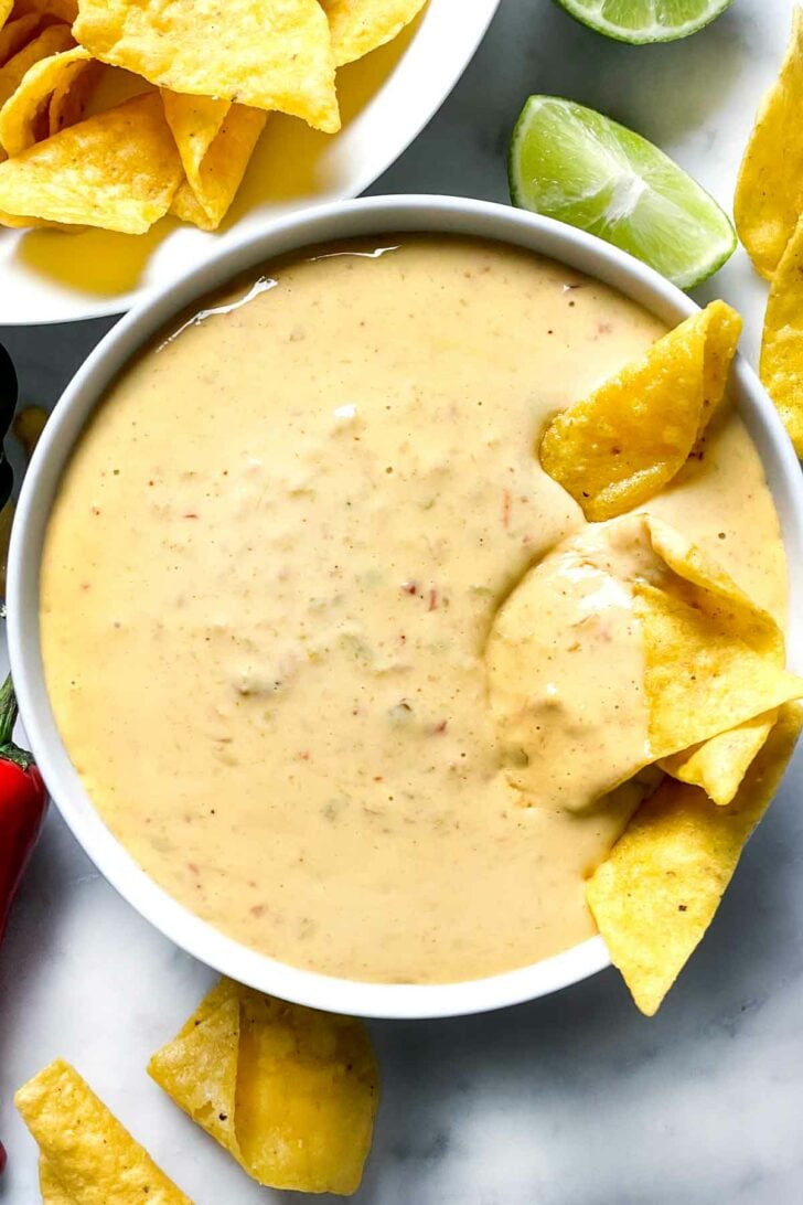 Queso Dip with chip foodiecrush.com