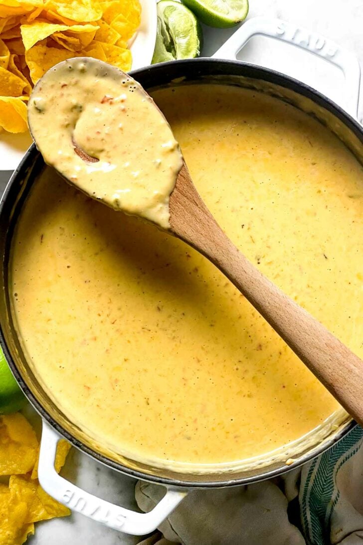Queso Dip in pot with spoon foodiecrush.com