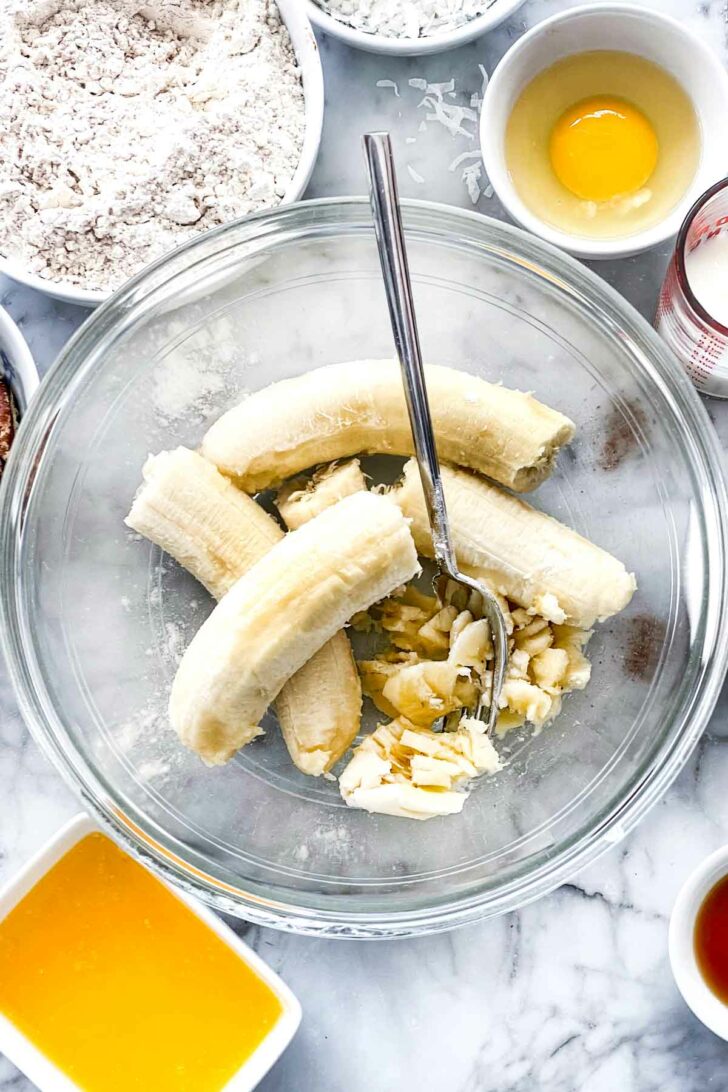 Mashed bananas in bowl foodiecrush.com