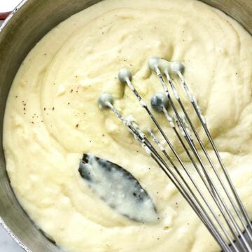Bechamel Sauce in saucepan with whisk foodiecrush.com