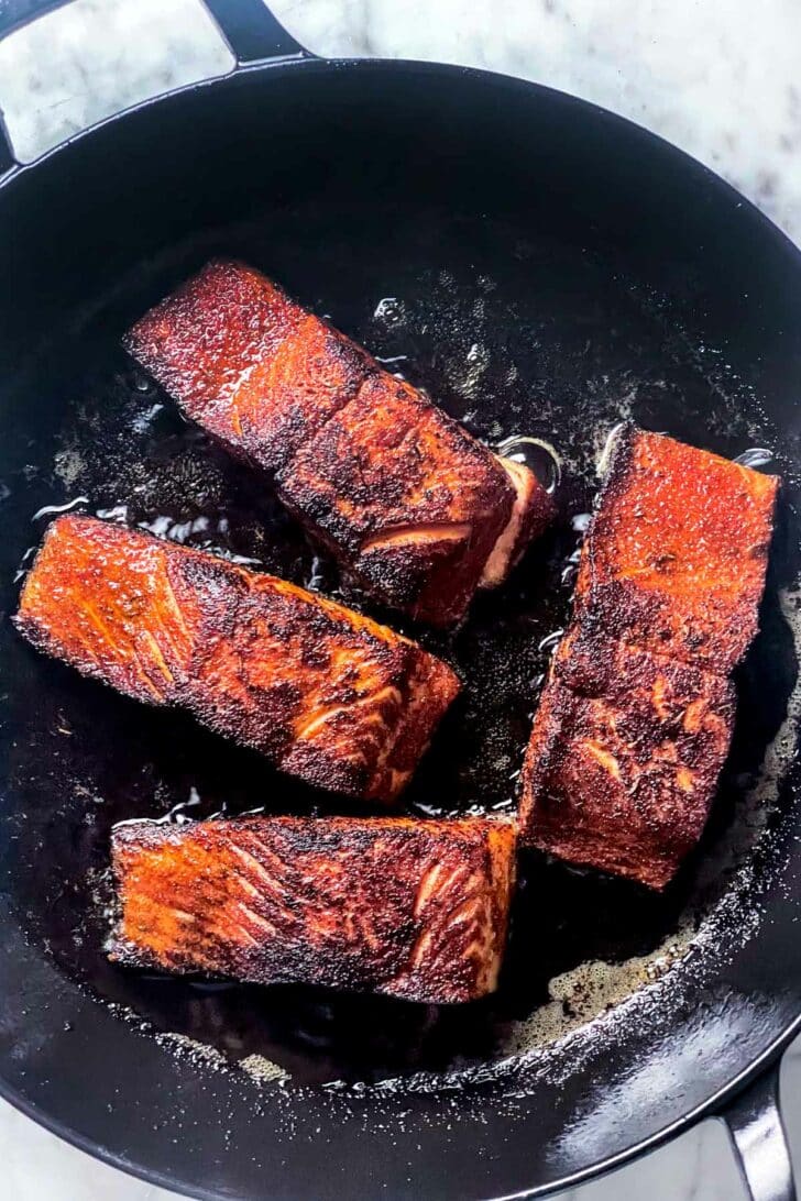 How to Cook Blackened Salmon in cast iron pan foodiecrush.com