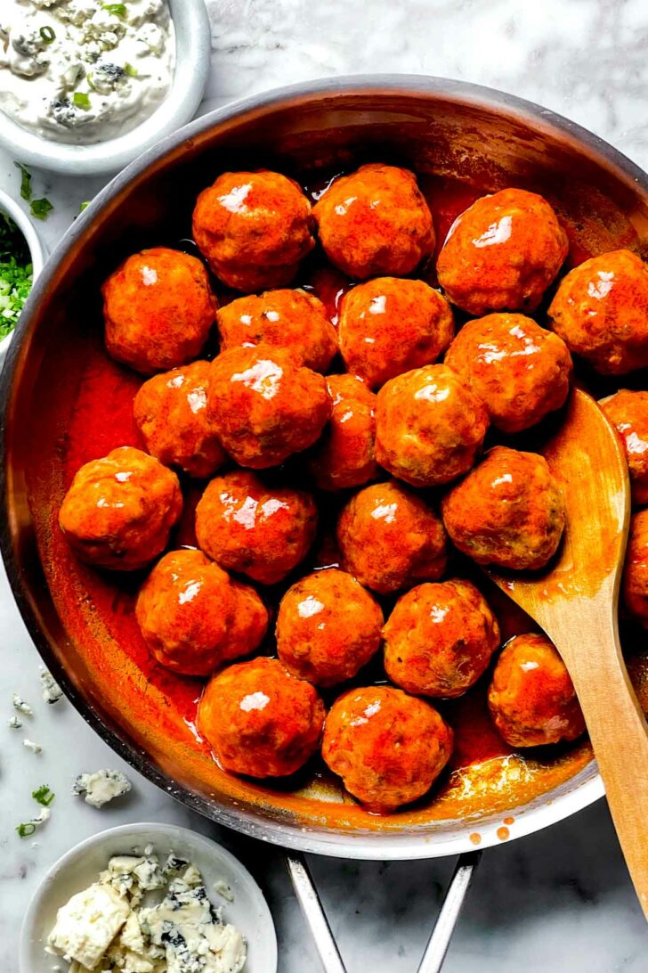 Buffalo Chicken Meatballs in skillet foodiecrush.com
