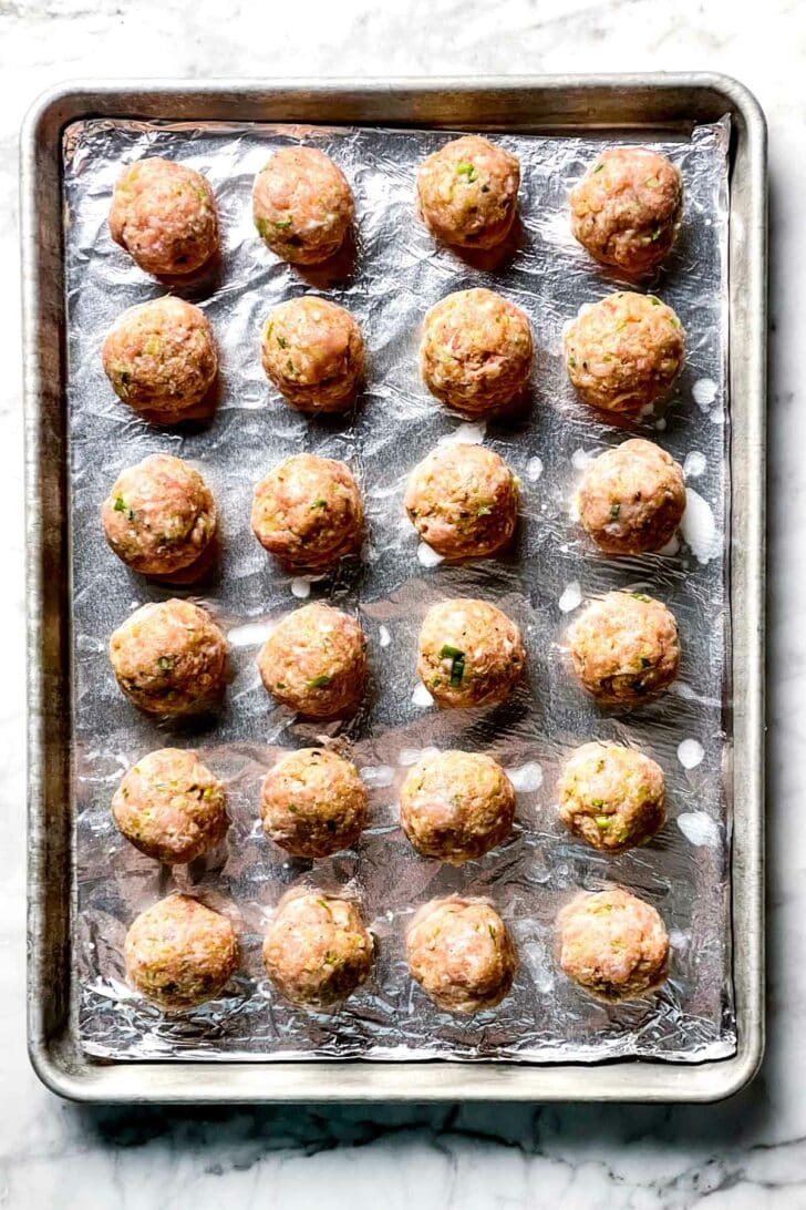Buffalo Chicken Meatballs on baking sheet foodiecrush.com