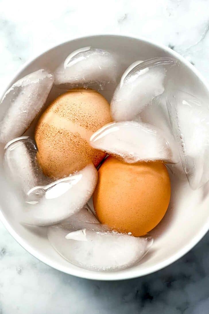 Hard boiled eggs in ice bath foodiecrush.com