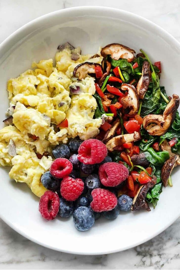Scrambled eggs, spinach, berries foodiecrush.com