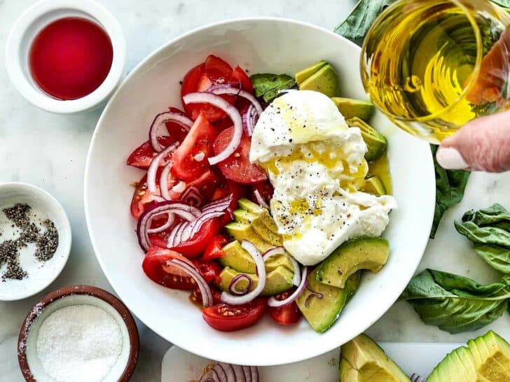 Burrata and Tomato Salad with Avocado ingredients in bowl foodiecrush.com