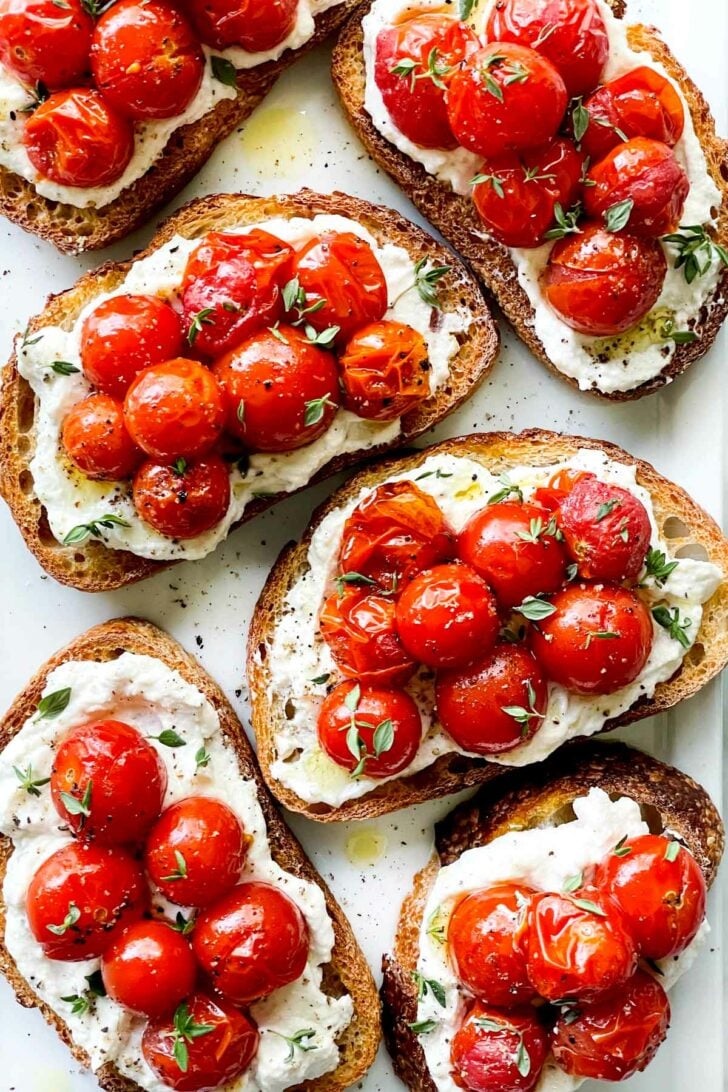Whipped Ricotta Toast Crostini with Roasted Tomatoes foodiecrush.com