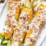 Elote Mexican Street Corn Esquites on platter with limes foodiecrush.com