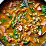 Lentil Soup with ladle in pot foodiecrush.com