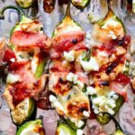 What's In Bacon Wrapped Jalapeño Poppers with Gorgonzola on baking sheet foodiecrush.com
